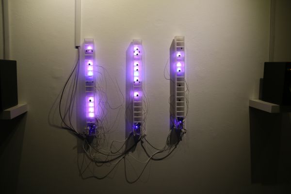three plexiglass columns with LEDs