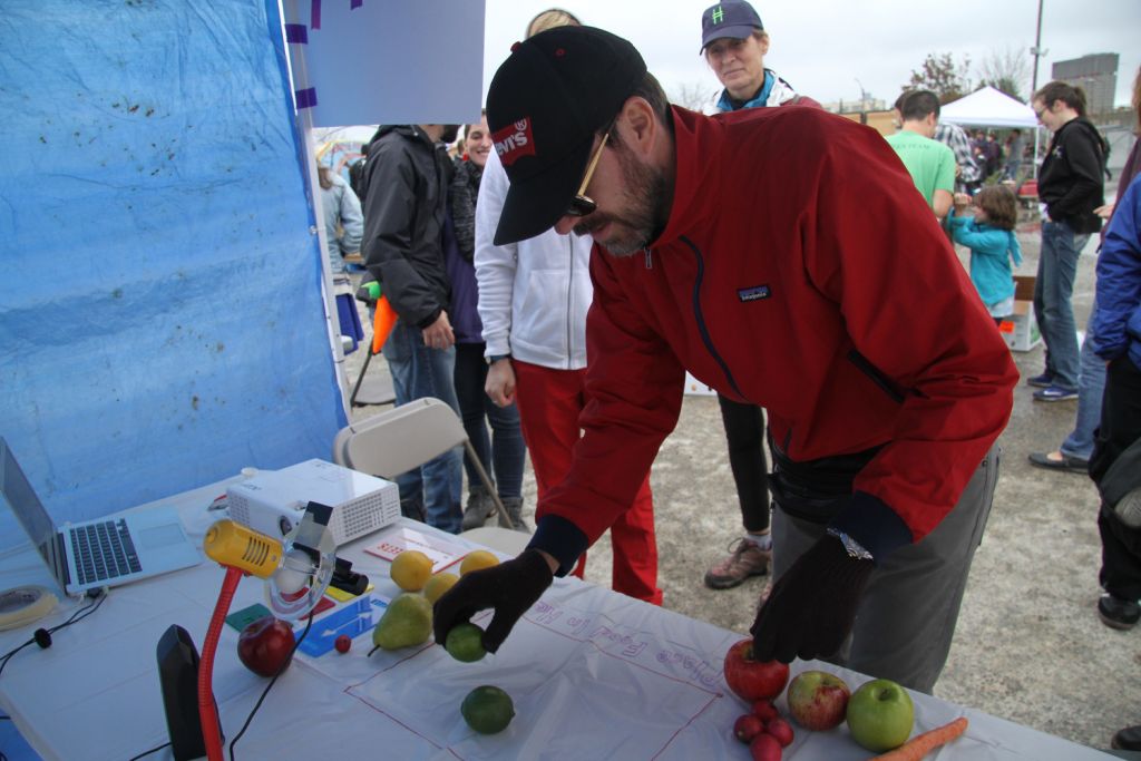 man placing fruit on table